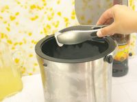 a person grabbing ice out of an ice bucket