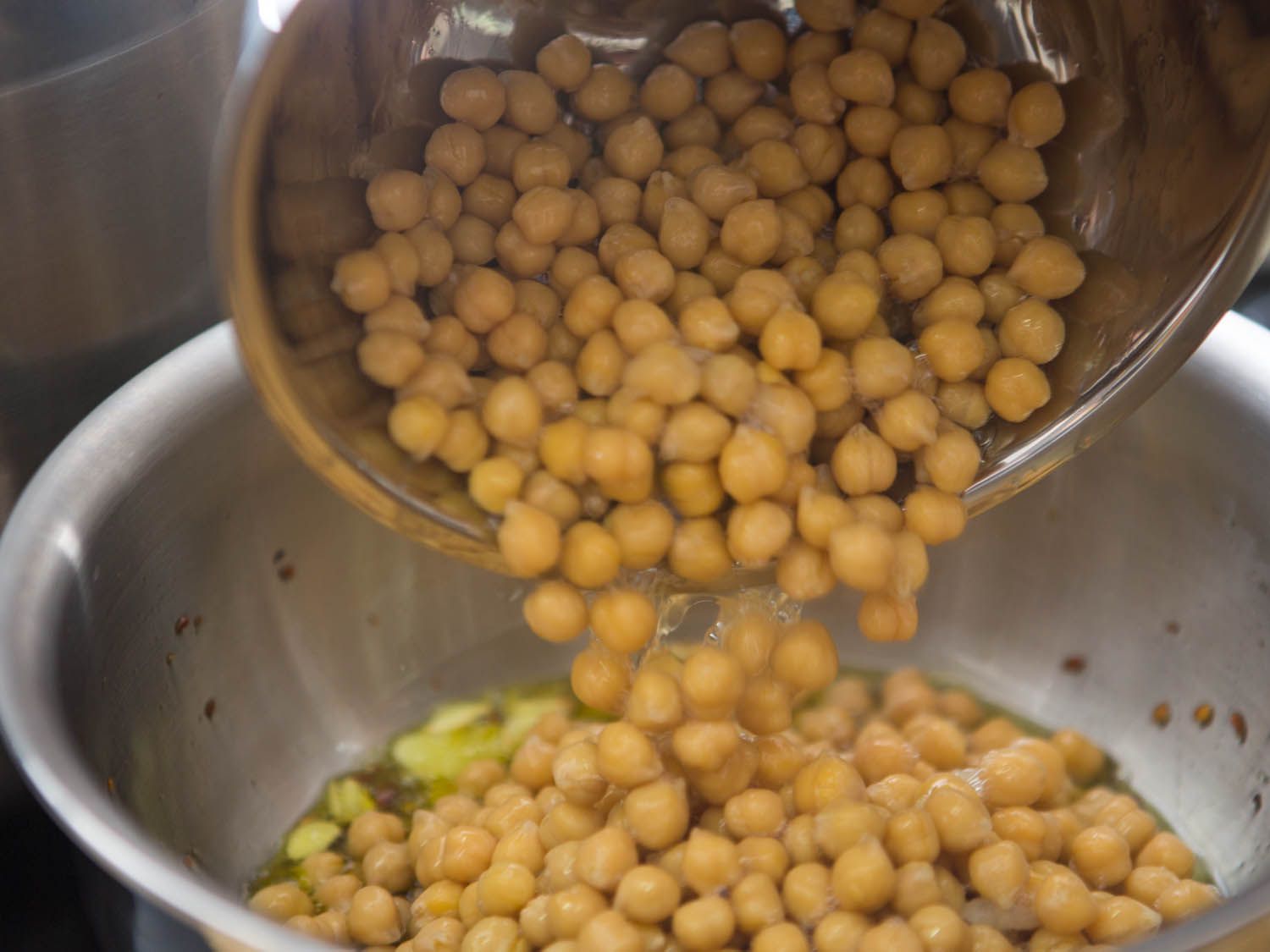 Chickpeas are added to the saucier.