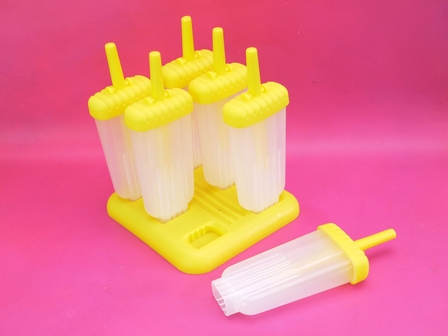 Tovolo popsicle molds on a pink background