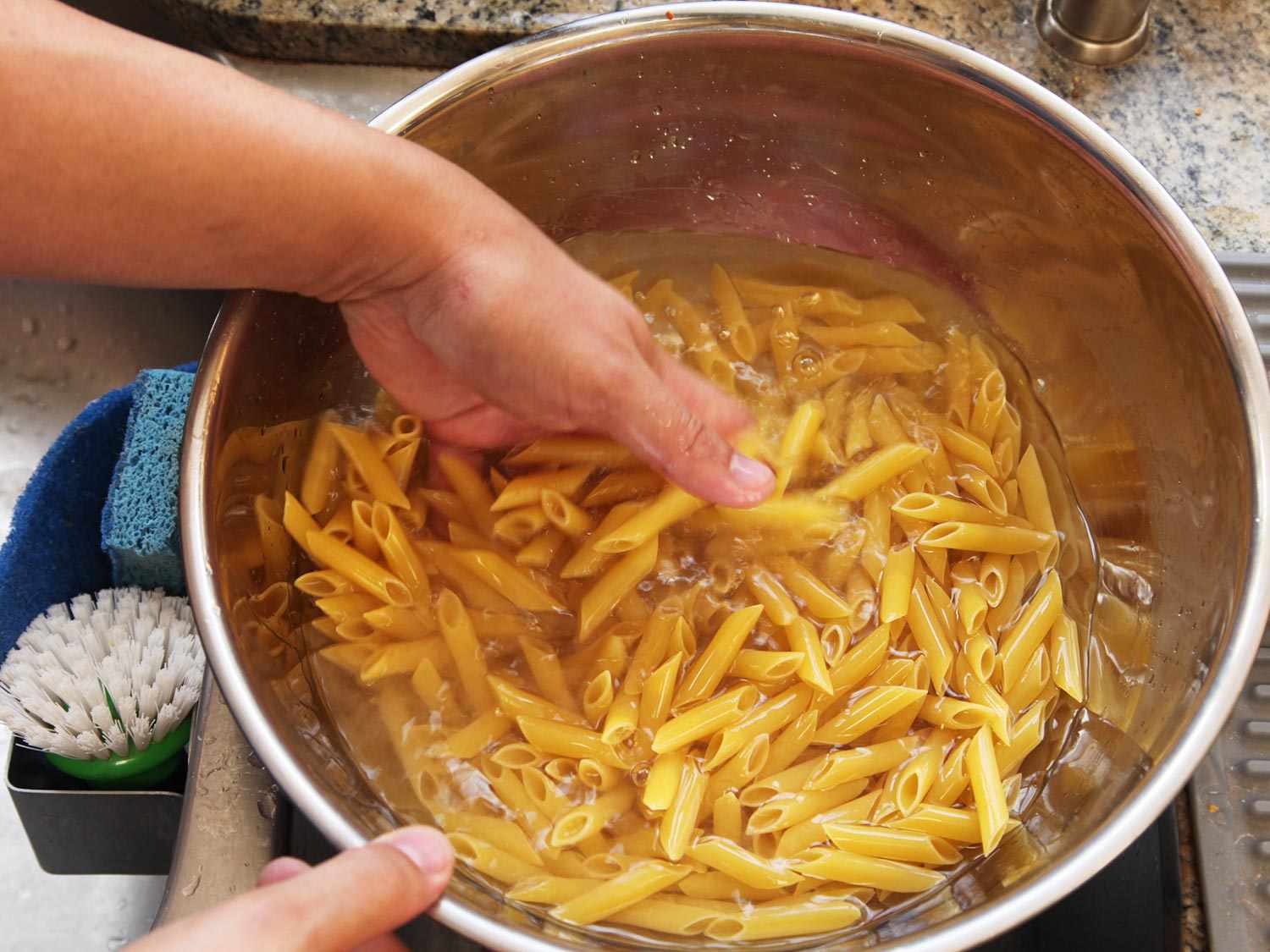 Soaking pasta in hot water. 