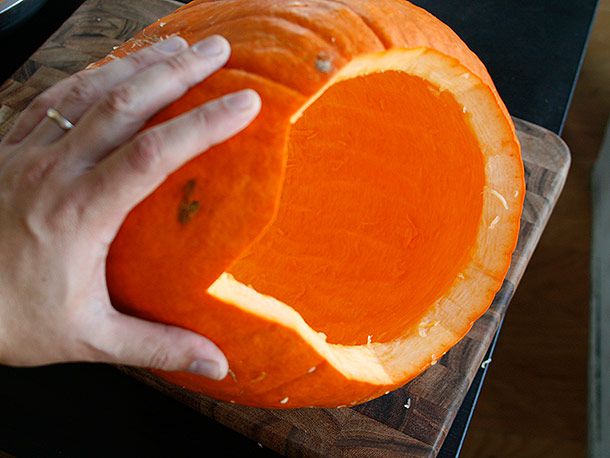Showing the partial interior of a scraped-out pumpkin
