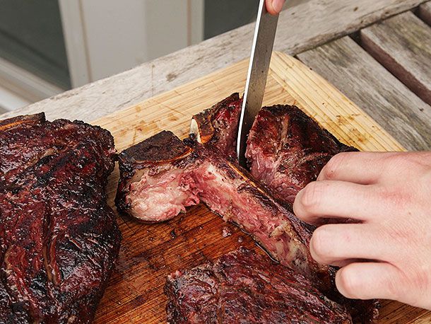 Author cutting the strip portion off of the T bone.