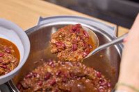 Chili made in the Instant Pot Duo Plus 8 Quart Multi-Use Pressure Cooker is spooned into a bowl