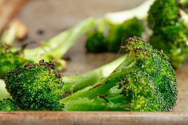 Roasted broccoli florets on a sheet pan