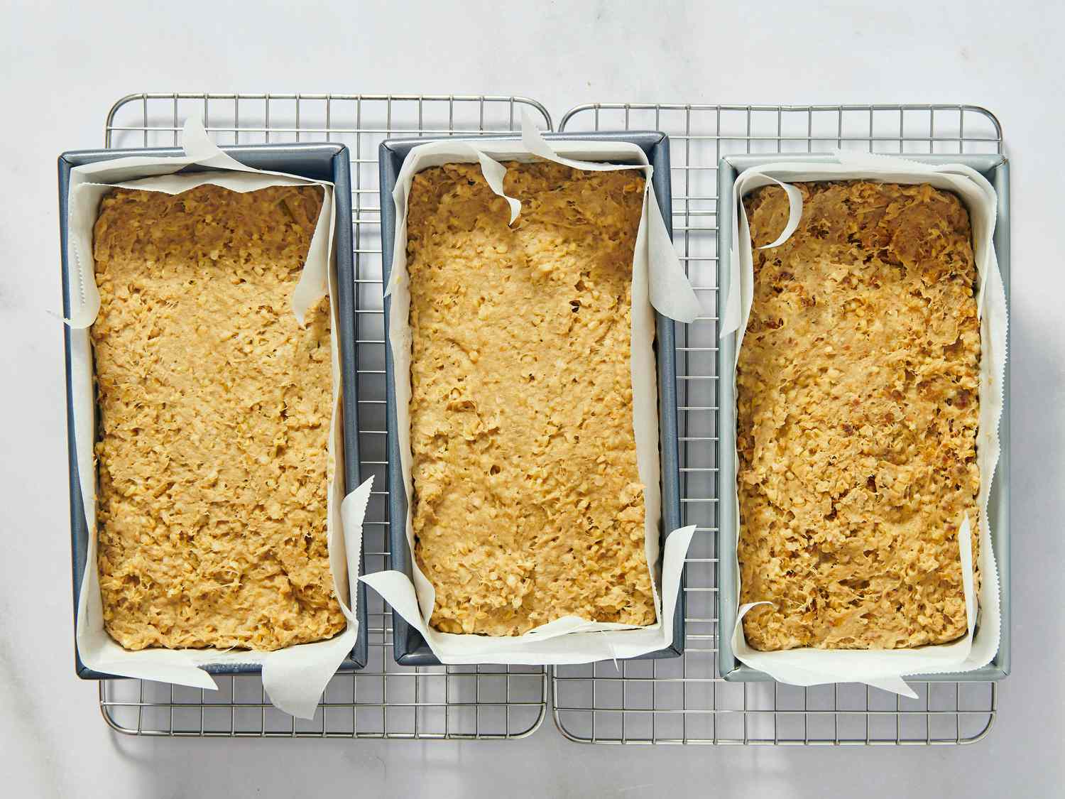 goetta in pans on a cooling racks