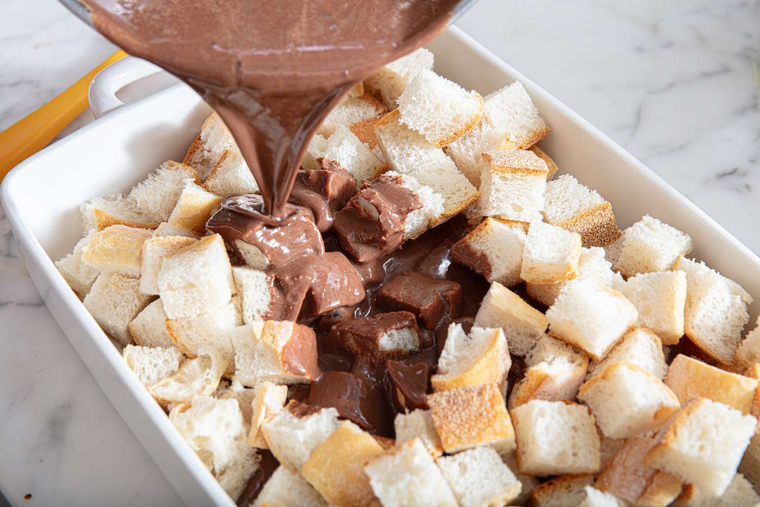 Overhead view of pouring into bread