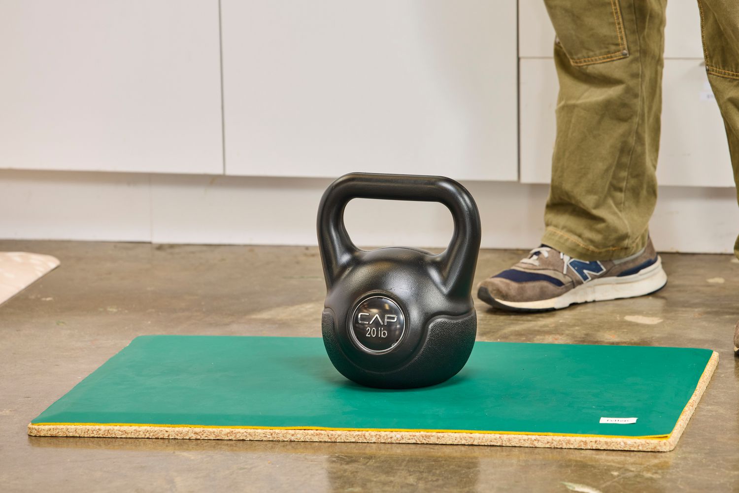 A kettlebell on top of the Fulton Standing Mat