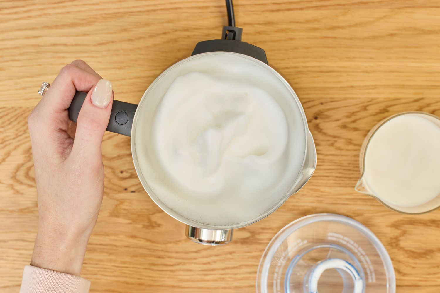 Frothed milk inside of a milk frother.