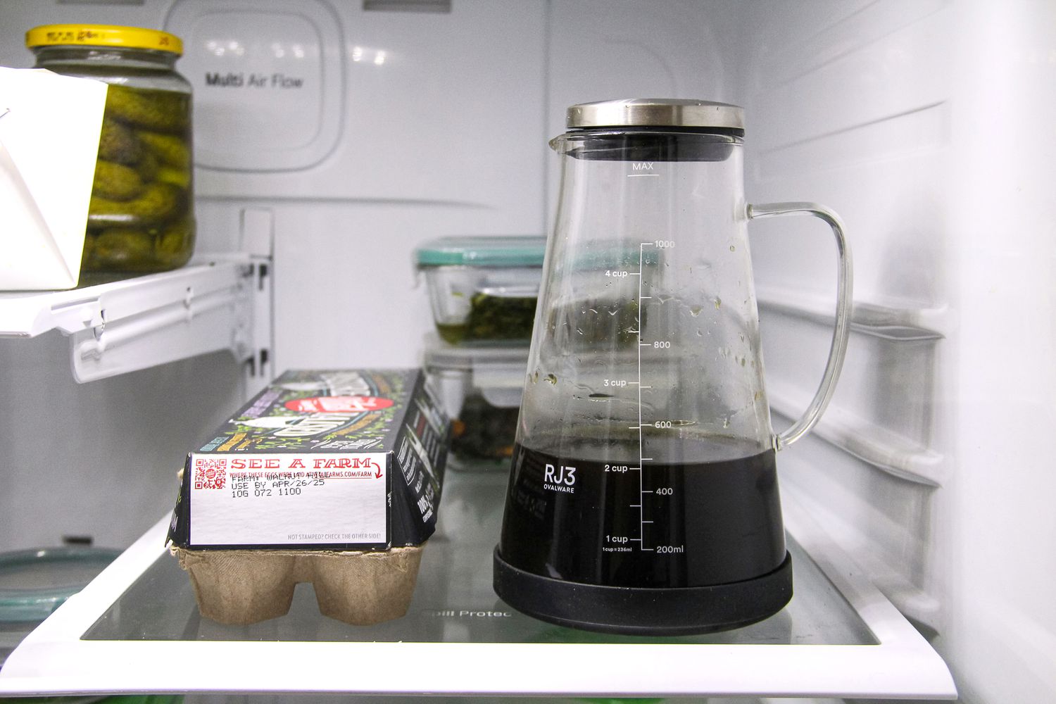 The Ovalware cold brew maker on a fridge shelf.