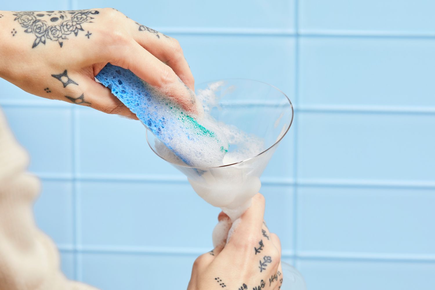 Person cleaning Williams Sonoma Reserve Martini Glasses