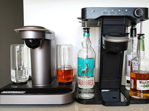 The Bartesian and Bev cocktail machines adjacent to each other on a kitchen counter.