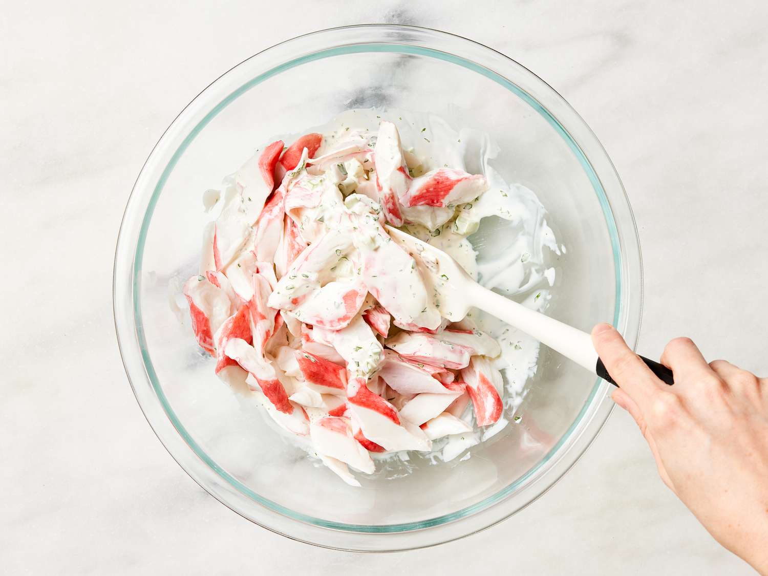 Mixing imitation crab with mayo