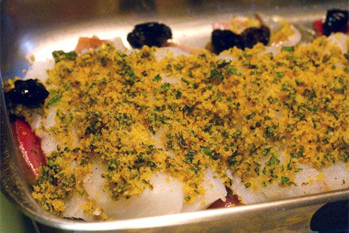 Sicilian-style baked cod in a pan prepped and ready to go into the oven.