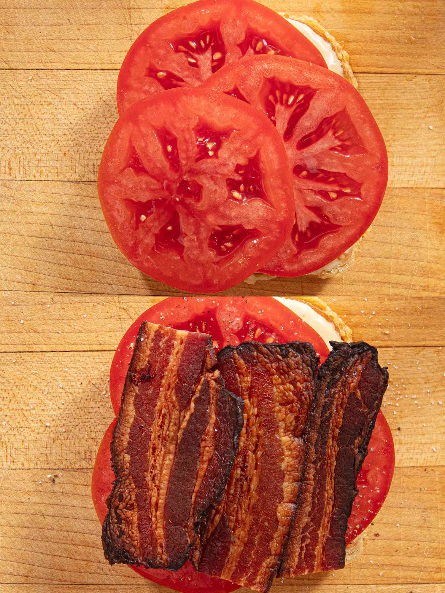 Tomatoes and bacon on a slice of sandwich bread with mayonnaise.