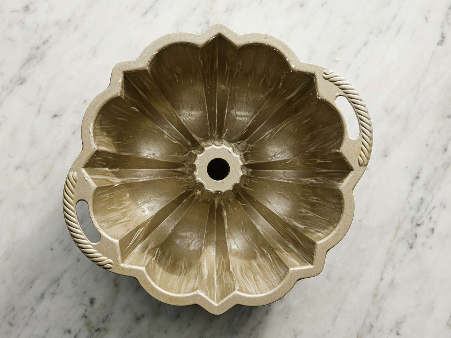Overhead view of a greased bundt pan