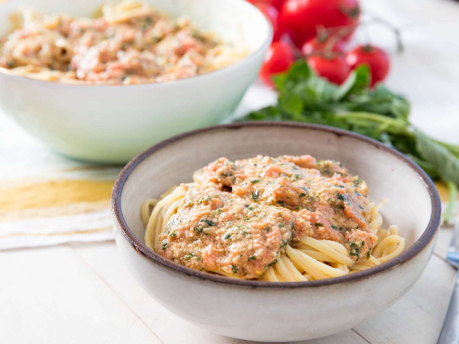 A bowl of pasta topped with pesto alla Trapanese
