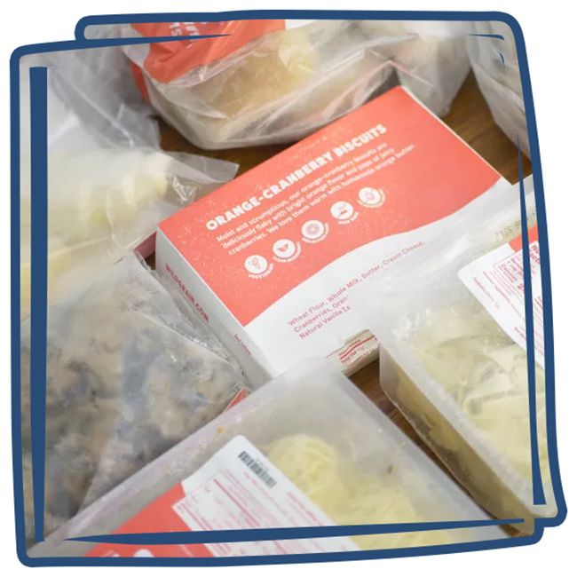 Assorted packaged food items including labeled product bags and a box of orangecranberry scones