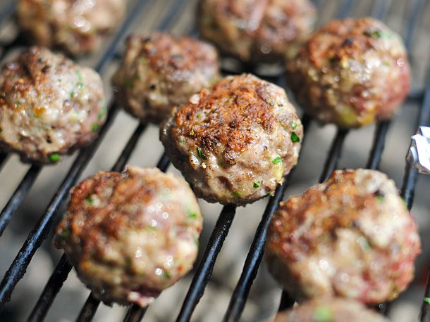 Close-up of meatballs grilling on charcoal grill