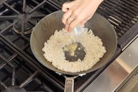 Rice is cooked in the Misen 12 Inch Carbon Steel Wok