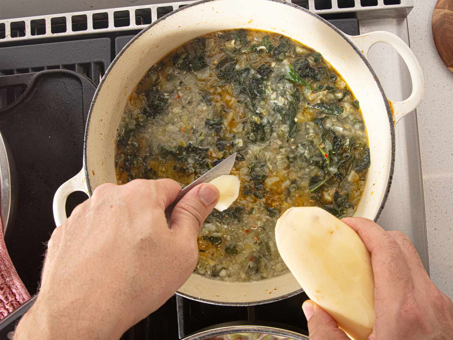 Overhead view of adding potatoes