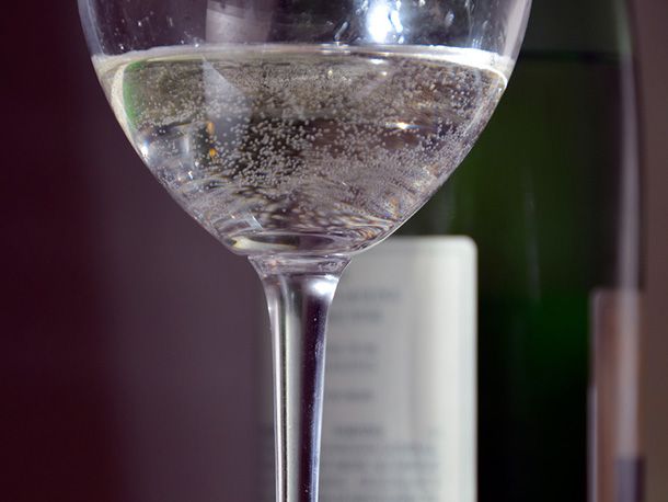 light bubbles in a glass of txakoli