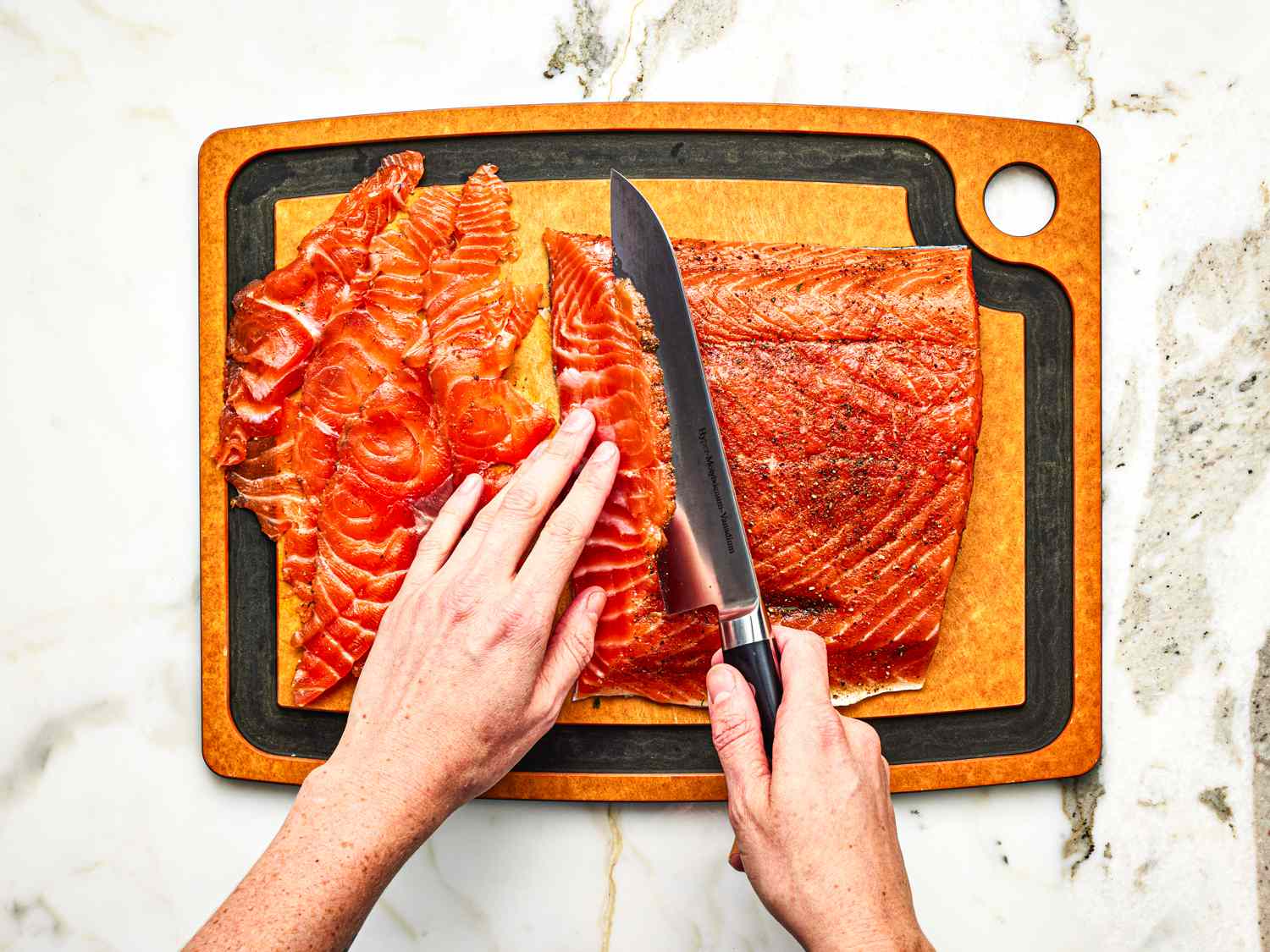 Overhead view of slicing the gravlax 
