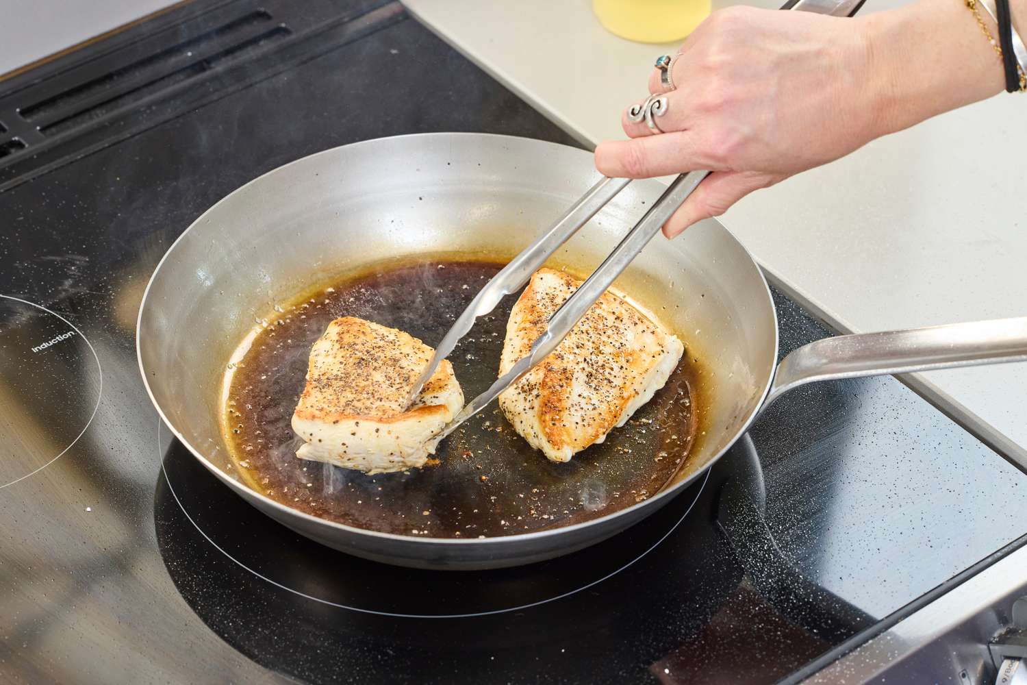 Chicken is cooked in the Vollrath 12.5 Inch French Style Carbon Steel Fry Pan