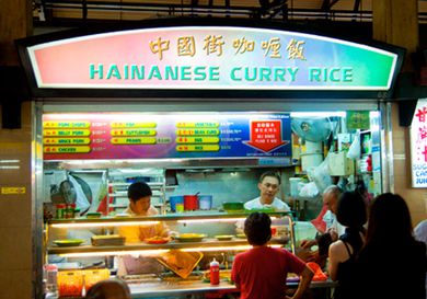 Hawker stand selling Hainanese curry rice in Singapore.