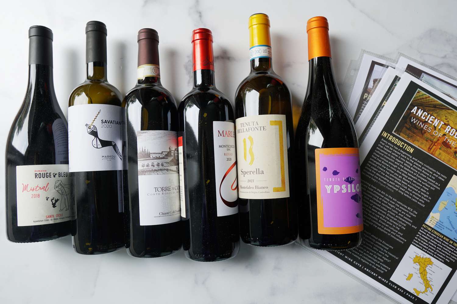a number of wines on a marble surface