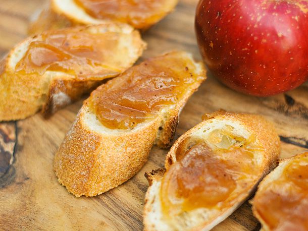 Several slices of baguette topped with apple butter.
