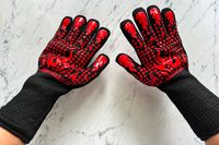 A person wears the Comsmart BBQ Gloves