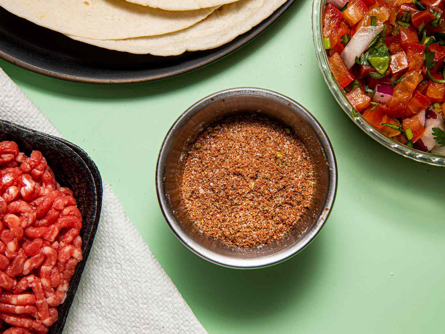 Overhead view of homemade taco seasoning in a small bowl
