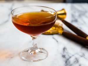 A 100-year-old cigar cocktail, served in a chilled coupe glass.