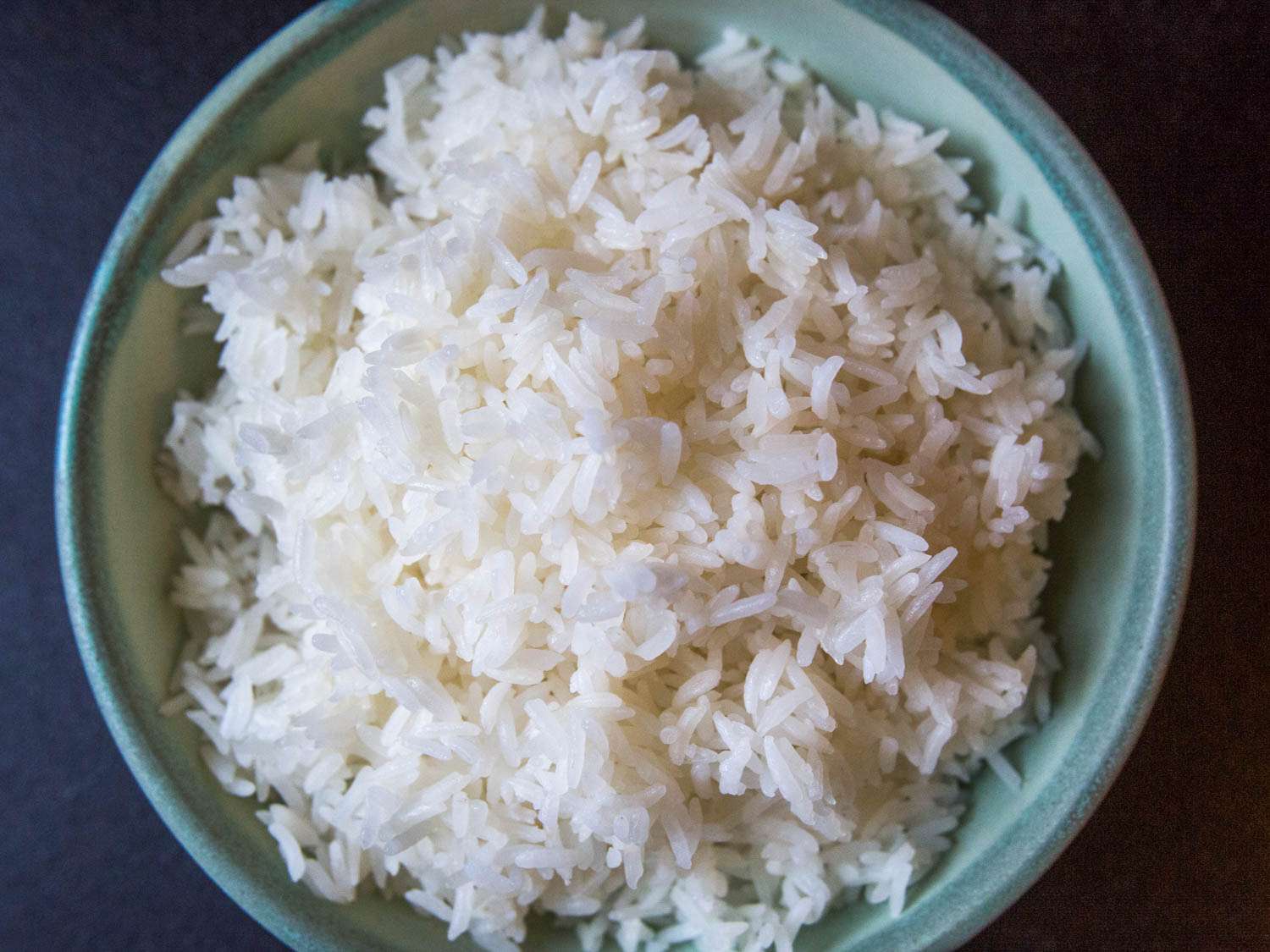 Overhead of a serving bowl of cooked Thai jasmine rice