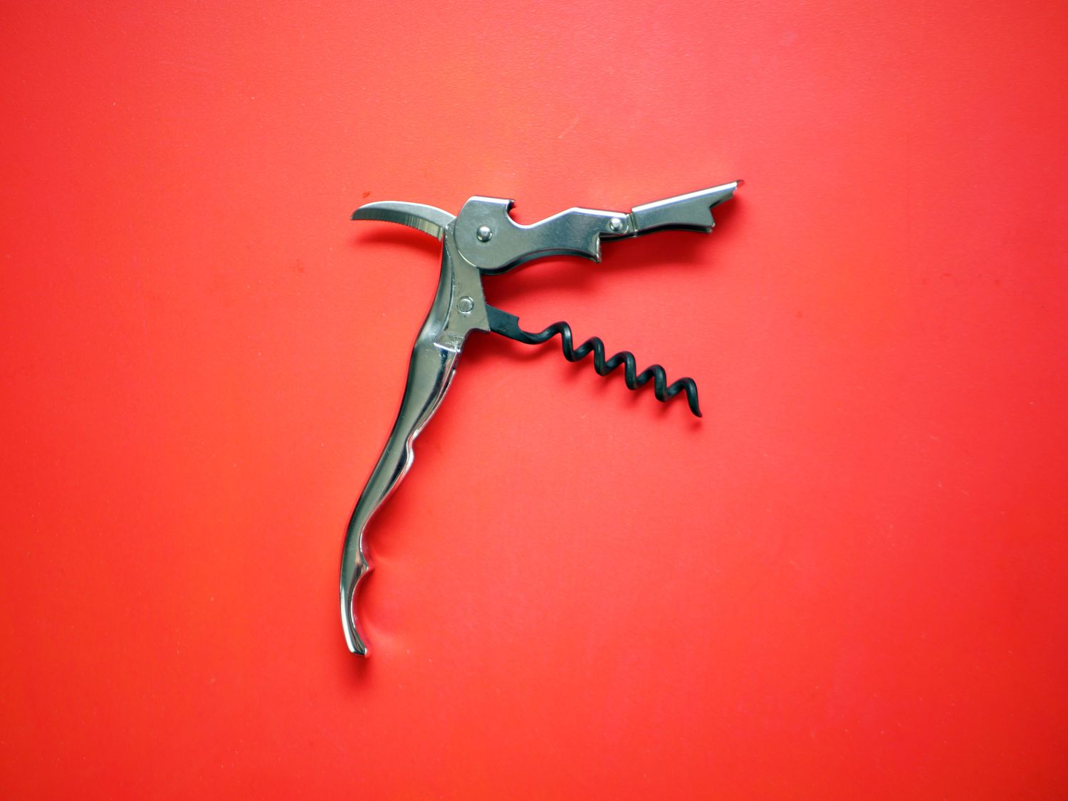 Pulltaps wine opener on a red background