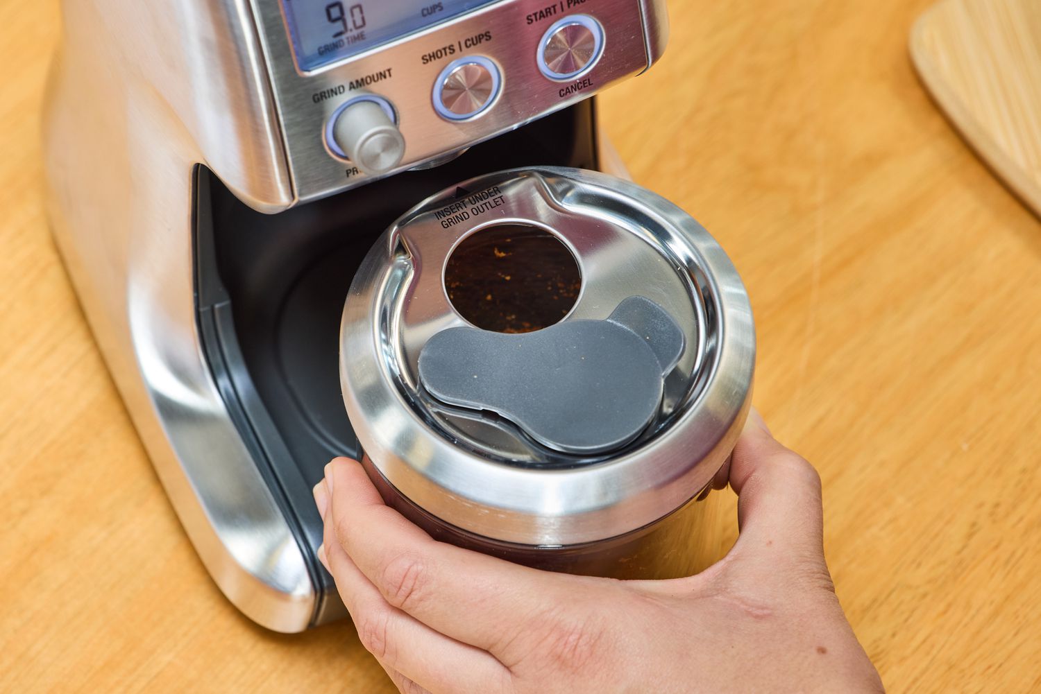 A person assembles the Breville The Smart Grinder Pro