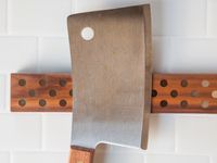 A cleaver on a magnetic knife strip