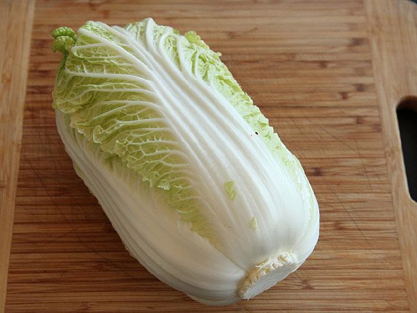 Napa cabbage on a cutting board. 