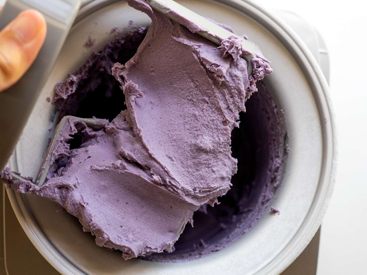 churning ube ice cream