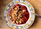 Overhead view of easy stovetop fruit crisp, served in a shallow bowl.