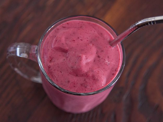 A glass of a mango blackberry smoothie. 