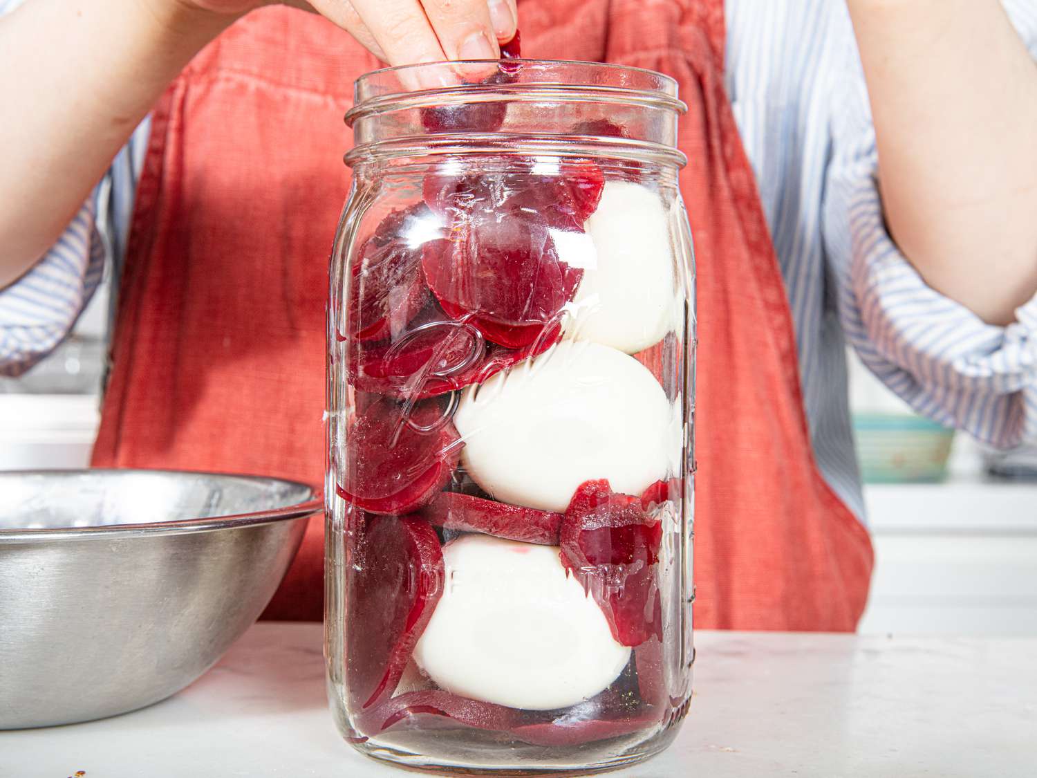 Placing beets into jar