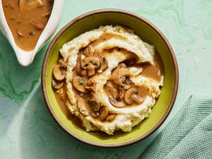 Overhead view of mushroom gravy poured on top of potatoes