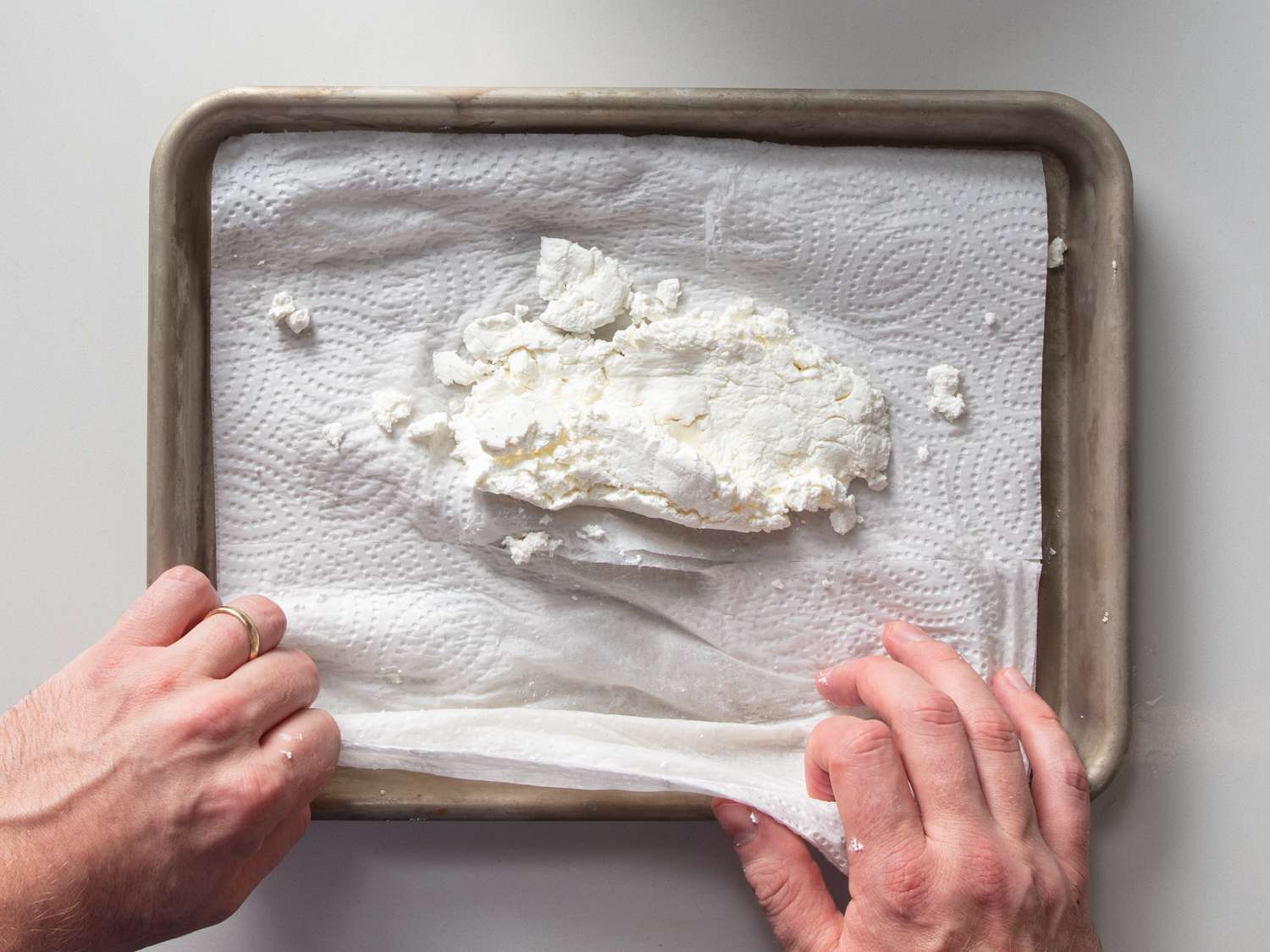 draining feta on a paper towel and blotting dry