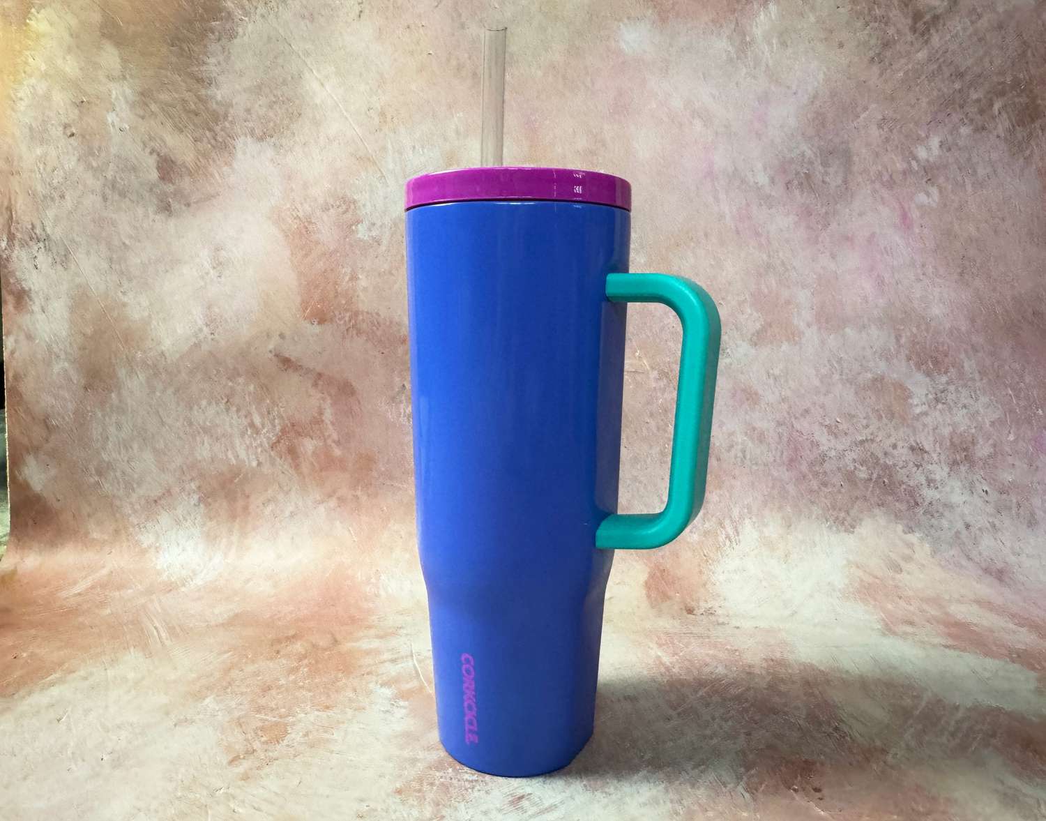 A blue and purple Corckicle insulated tumbler. 