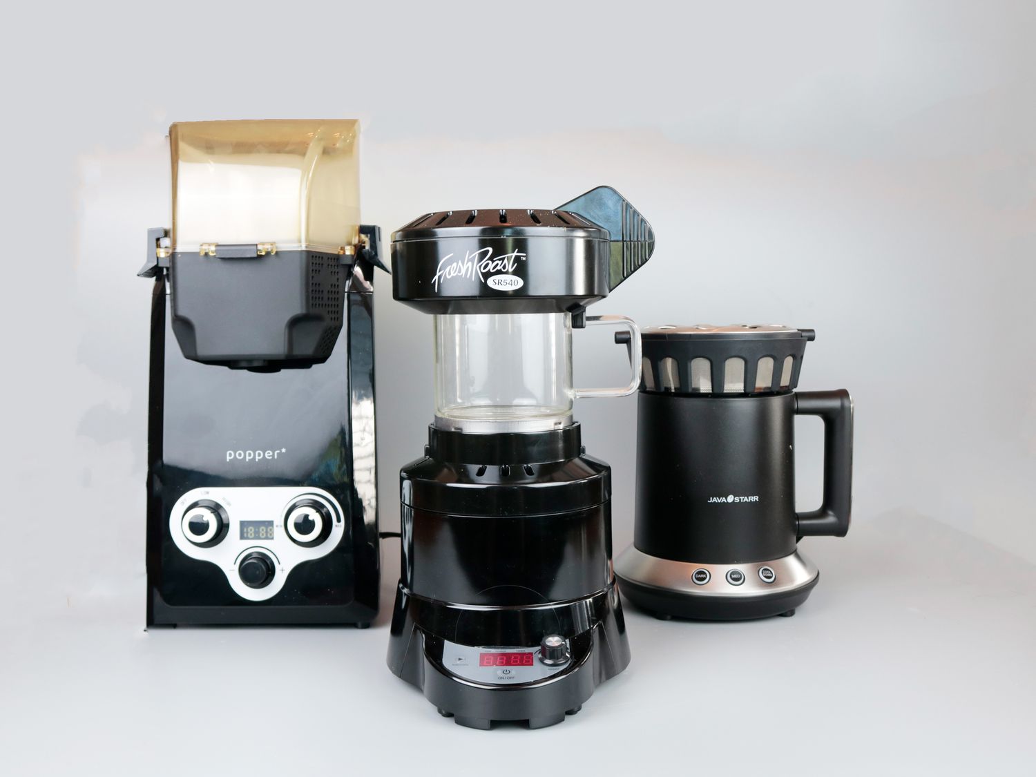 three home coffe roasters on a gray background