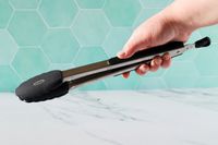 A person holding the OXO 12-Inch Silicone Tongs