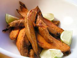 Sweet potato fries with lime wedges