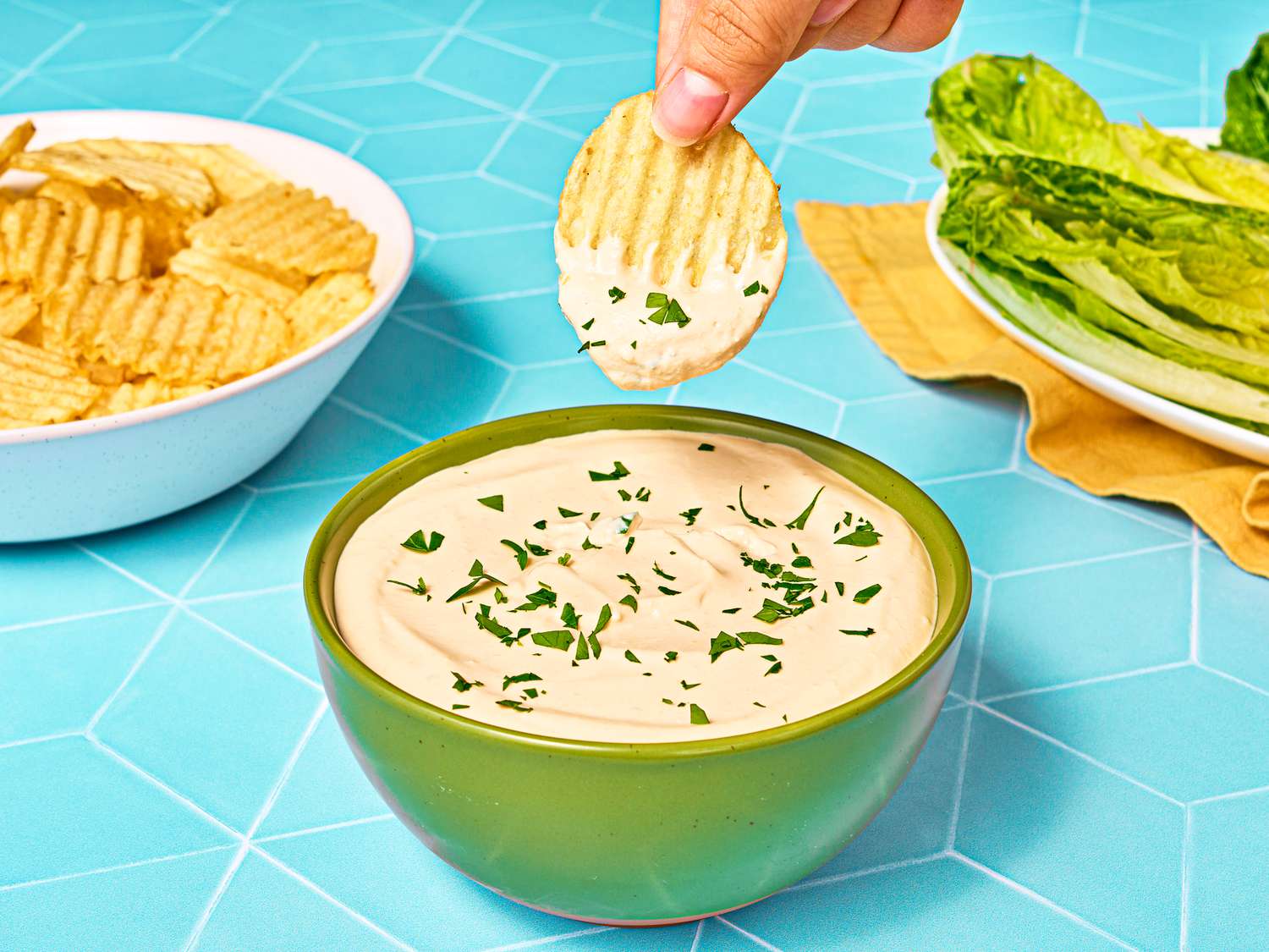 Dipping a chip in the caesar dip