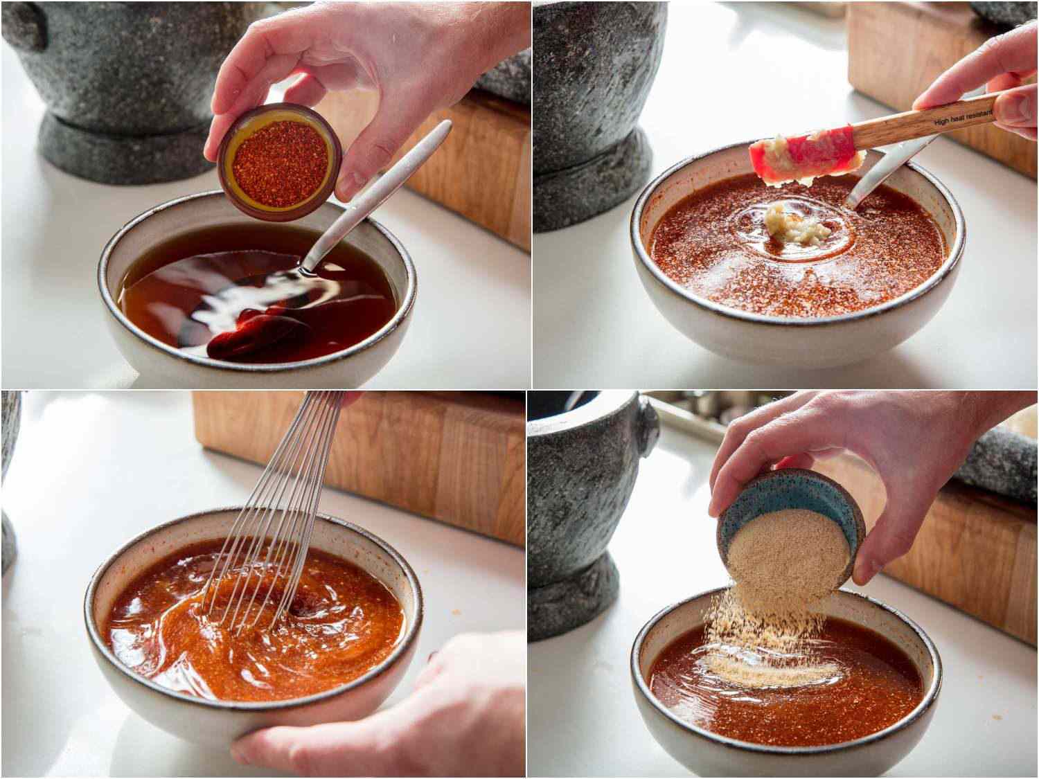 Whisking dried chilies, garlic, and toasted rice powder into dipping sauce.